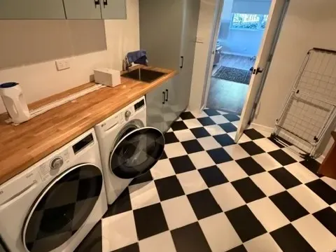 Laundry renovation, checkerboard floor and timber benchtop